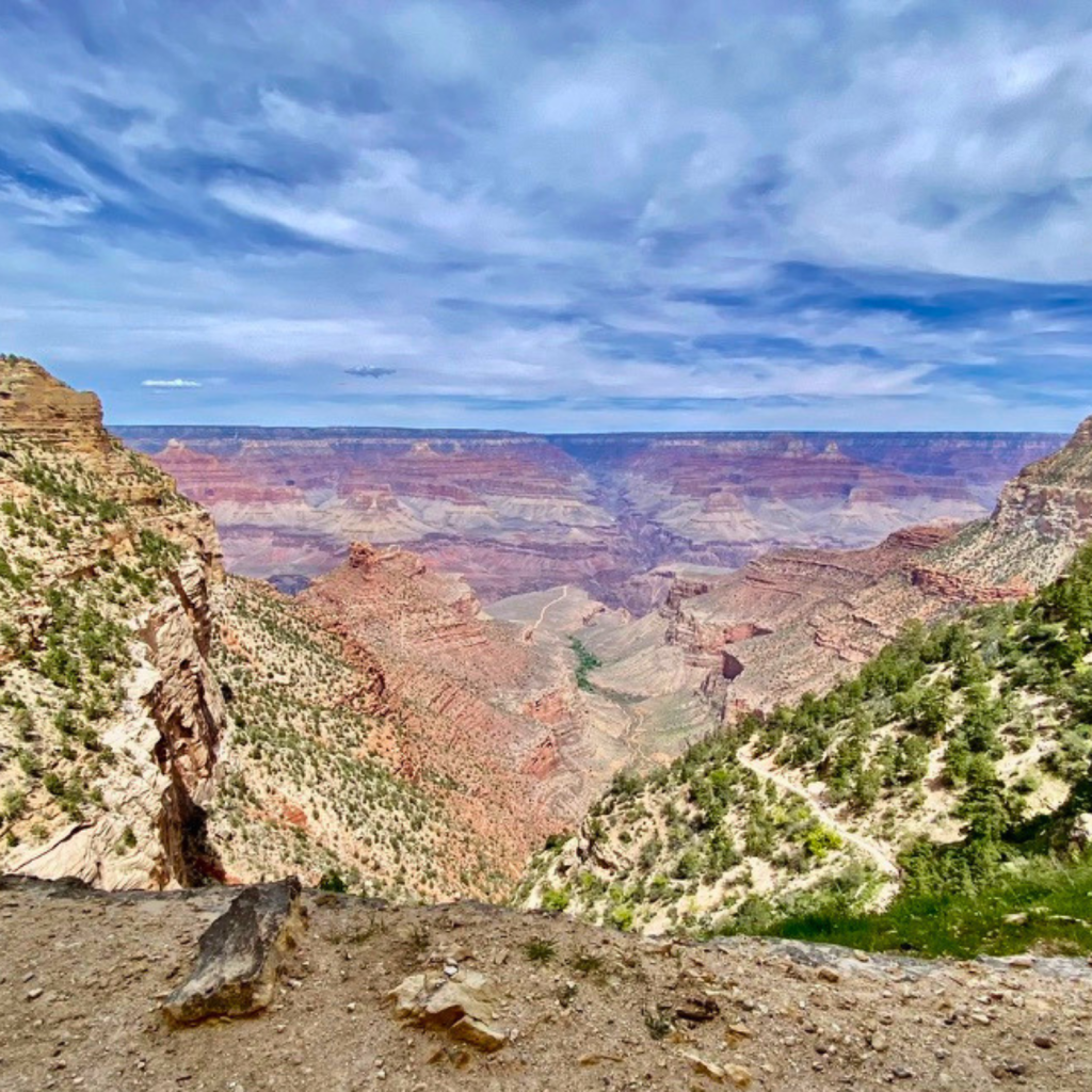 Grand Canyon landscape representing recurring themes of resilience, memory, voice, and spiritual geography in the poetry of Iris Lennox.